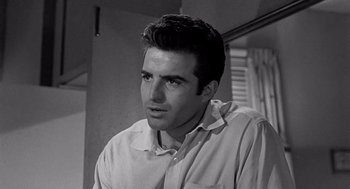 Movie still from “Murder by Contract” (1958), directed by Irving Lerner – Black and white photograph of a man in a dress shirt; Close Up shot, Low angle