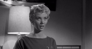 Movie still from “Murder by Contract” (1958), directed by Irving Lerner – A black and white photo of a woman with short blonde hair; Close Up shot, Low angle