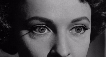 Movie still from “Murder by Contract” (1958), directed by Irving Lerner – A woman's eyes in black and white; Extreme Close Up shot, Overhead angle