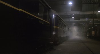 Movie still from “Murder on the Orient Express” (1974), directed by Sidney Lumet – A train on a train track near a train station; Extreme Wide shot, Low angle
