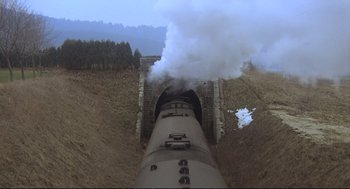 Movie still from “Murder on the Orient Express” (1974), directed by Sidney Lumet – An overhead view of a train going through a tunnel; Extreme Wide shot, High angle
