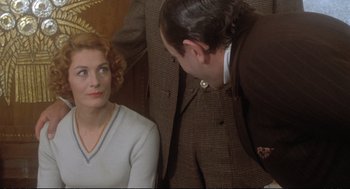 Movie still from “Murder on the Orient Express” (1974), directed by Sidney Lumet – A man and a woman are looking at each other; Close Up shot, Over the shoulder angle