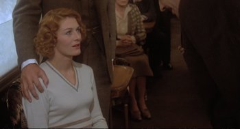 Movie still from “Murder on the Orient Express” (1974), directed by Sidney Lumet – A group of people sitting in a room; Medium shot, Over the shoulder angle