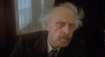 Movie still from “Murder on the Orient Express” (1974), directed by Sidney Lumet – An old man with a beard and a mustache; Close Up shot, Low angle