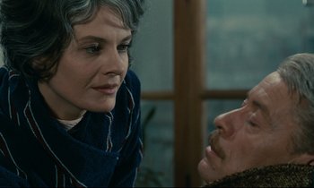 Movie still from “Muriel” (1963), directed by Alain Resnais – A man and a woman looking at one another; Close Up shot, Over the shoulder angle