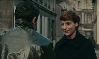 Movie still from “Muriel” (1963), directed by Alain Resnais – A man and a woman are talking to each other; Close Up shot, Over the shoulder angle