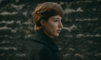 Movie still from “Muriel” (1963), directed by Alain Resnais – A person with short hair; Close Up shot, Over the shoulder angle