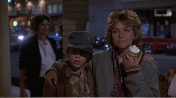Movie still from “Murphy's Romance” (1985), directed by Martin Ritt – A woman and a child are standing together; Close Up shot, Over the shoulder angle