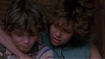 Movie still from “Murphy's Romance” (1985), directed by Martin Ritt – Two young children are looking at a cell phone; Close Up shot, Over the shoulder angle