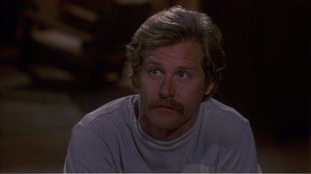 Movie still from “Murphy's Romance” (1985), directed by Martin Ritt – A person with a mustache; Close Up shot, High angle