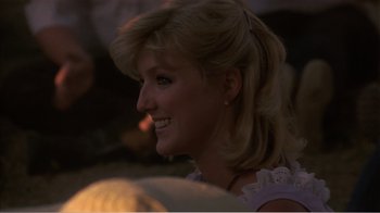 Movie still from “Murphy's Romance” (1985), directed by Martin Ritt – A person with long blonde hair; Close Up shot, Over the shoulder angle
