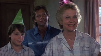 Movie still from “Murphy's Romance” (1985), directed by Martin Ritt – A group of people standing next to each other wearing party hats; Close Up shot, Low angle