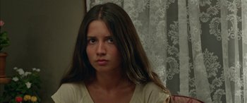 Movie still from “Mustang” (2015), directed by Deniz Gamze Ergüven – A woman with long brown hair sitting in front of a window; Close Up shot, Over the shoulder angle