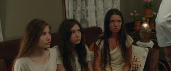 Movie still from “Mustang” (2015), directed by Deniz Gamze Ergüven – A group of young women sitting on a couch; Medium shot, High angle