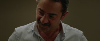 Movie still from “Mustang” (2015), directed by Deniz Gamze Ergüven – A person wearing a white shirt; Close Up shot, Over the shoulder angle