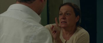 Movie still from “Mustang” (2015), directed by Deniz Gamze Ergüven – An older woman in front of a man in the mirror; Close Up shot, Over the shoulder angle