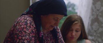 Movie still from “Mustang” (2015), directed by Deniz Gamze Ergüven – An older woman and a young girl wearing a headscarf; Close Up shot, Low angle