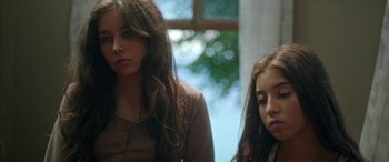 Movie still from “Mustang” (2015), directed by Deniz Gamze Ergüven – Two young women sitting next to each other in front of a window; Close Up shot, Over the shoulder angle