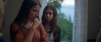 Movie still from “Mustang” (2015), directed by Deniz Gamze Ergüven – Two young girls are sitting next to each other; Close Up shot, Over the shoulder angle