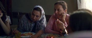 Movie still from “Mustang” (2015), directed by Deniz Gamze Ergüven – Two women sitting at a table eating food; Close Up shot, High angle