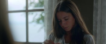 Movie still from “Mustang” (2015), directed by Deniz Gamze Ergüven – A woman sitting in front of a window looking down; Close Up shot, Low angle