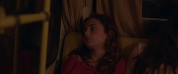 Movie still from “Mustang” (2015), directed by Deniz Gamze Ergüven – A young girl sitting on a train looking out the window; Close Up shot, Over the shoulder angle