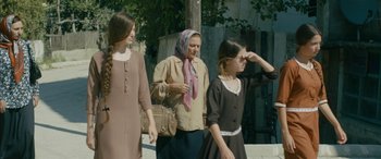Movie still from “Mustang” (2015), directed by Deniz Gamze Ergüven – A group of women walking down a street; Medium shot, Over the shoulder angle