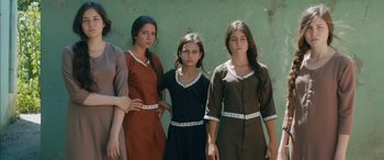 Movie still from “Mustang” (2015), directed by Deniz Gamze Ergüven – A group of young women standing next to each other; Medium shot, High angle