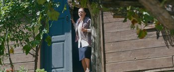 Movie still from “Mustang” (2015), directed by Deniz Gamze Ergüven – A woman standing in front of an open door of a house; Medium shot, Low angle