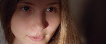 Movie still from “Mustang” (2015), directed by Deniz Gamze Ergüven – A young woman's face with brown eyes; Extreme Close Up shot, Low angle