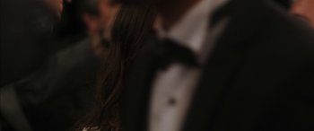 Movie still from “Mustang” (2015), directed by Deniz Gamze Ergüven – A person wearing a suit and tie; Close Up shot, Over the shoulder angle