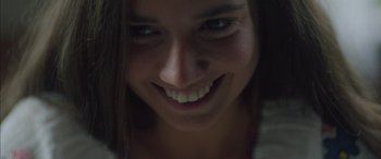 Movie still from “Mustang” (2015), directed by Deniz Gamze Ergüven – A woman's face with a smile; Extreme Close Up shot, Low angle