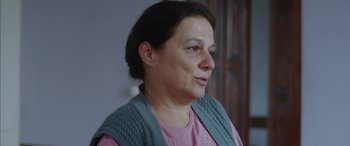Movie still from “Mustang” (2015), directed by Deniz Gamze Ergüven – A person wearing a pink shirt; Close Up shot, Over the shoulder angle