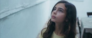 Movie still from “Mustang” (2015), directed by Deniz Gamze Ergüven – A young girl looking up into the air; Close Up shot, Low angle