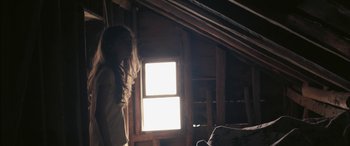 Movie still from “Mustang” (2015), directed by Deniz Gamze Ergüven – A person standing in a room with a window in the background; Wide shot, Low angle