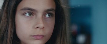 Movie still from “Mustang” (2015), directed by Deniz Gamze Ergüven – A young girl's eyes and face; Close Up shot, Low angle