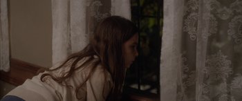 Movie still from “Mustang” (2015), directed by Deniz Gamze Ergüven – A young girl looking out of a window at night; Close Up shot, High angle