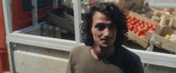 Movie still from “Mustang” (2015), directed by Deniz Gamze Ergüven – A person with long black hair; Close Up shot, Over the shoulder angle