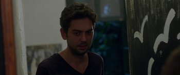 Movie still from “Mustang” (2015), directed by Deniz Gamze Ergüven – A person wearing a black t - shirt; Close Up shot, Over the shoulder angle