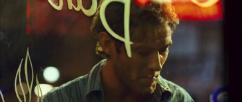 Movie still from “My Blueberry Nights” (2007), directed by Kar-Wai Wong – A person smoking a cigarette; Close Up shot, Over the shoulder angle