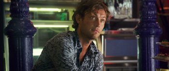 Movie still from “My Blueberry Nights” (2007), directed by Kar-Wai Wong – A person sitting in a room; Close Up shot, Low angle