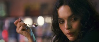 Movie still from “My Blueberry Nights” (2007), directed by Kar-Wai Wong – A person holding a paint brush; Close Up shot, Over the shoulder angle