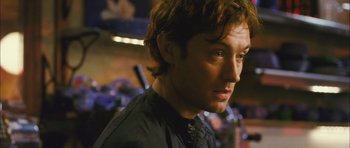 Movie still from “My Blueberry Nights” (2007), directed by Kar-Wai Wong – A person wearing a black shirt; Close Up shot, Over the shoulder angle