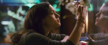 Movie still from “My Blueberry Nights” (2007), directed by Kar-Wai Wong – A beautiful young lady looking up at the sky; Close Up shot, Low angle