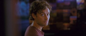 Movie still from “My Blueberry Nights” (2007), directed by Kar-Wai Wong – A person wearing a red shirt; Close Up shot, Over the shoulder angle