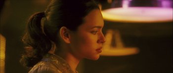 Movie still from “My Blueberry Nights” (2007), directed by Kar-Wai Wong – A person looking to the side; Close Up shot, Over the shoulder angle