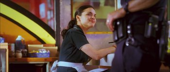 Movie still from “My Blueberry Nights” (2007), directed by Kar-Wai Wong – A woman sitting at a table in front of a man; Close Up shot, Over the shoulder angle
