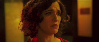 Movie still from “My Blueberry Nights” (2007), directed by Kar-Wai Wong – A person wearing a red shirt; Close Up shot, High angle