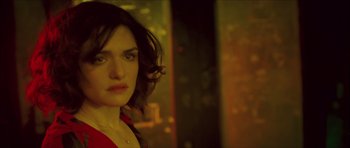 Movie still from “My Blueberry Nights” (2007), directed by Kar-Wai Wong – A person wearing a red shirt; Close Up shot, Over the shoulder angle