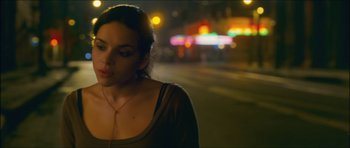 Movie still from “My Blueberry Nights” (2007), directed by Kar-Wai Wong – A woman standing on the side of a road at night; Close Up shot, Low angle